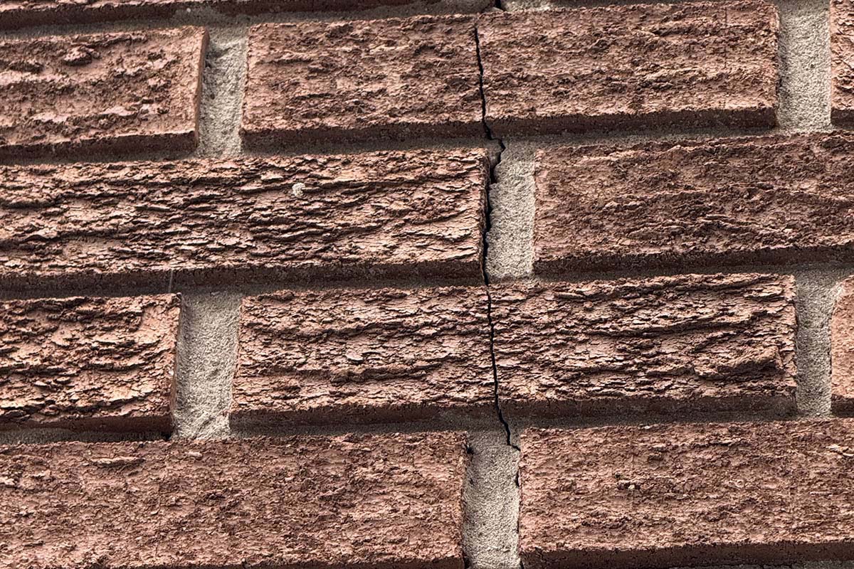 Cracking in masonry wall indicating structural distress